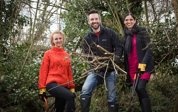 Colleagues taking part in a tree conservation event